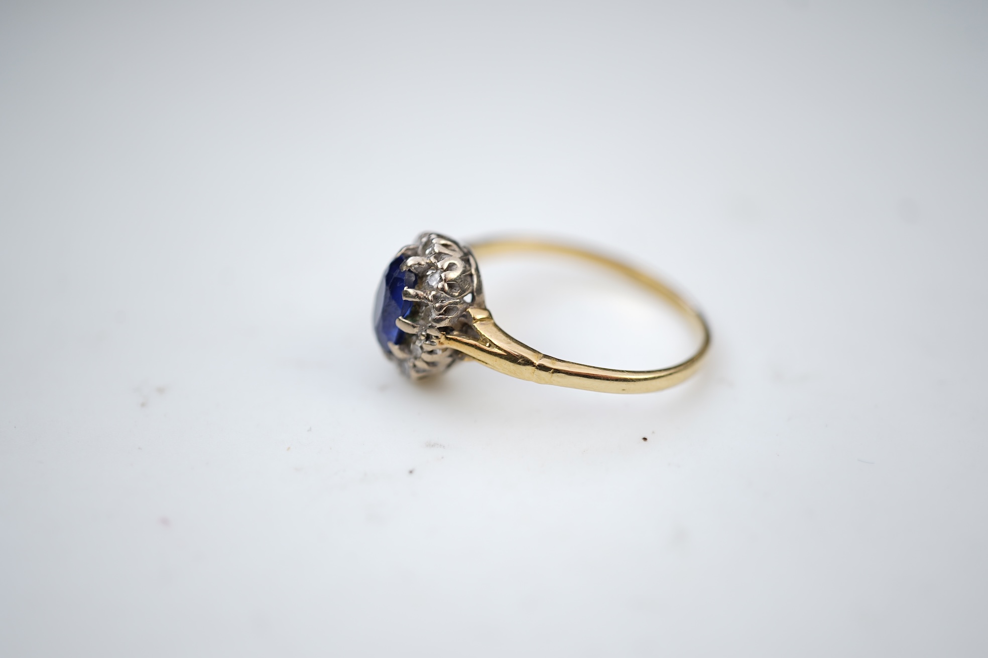 A synthetic sapphire and diamond cluster ring, mid 20th century